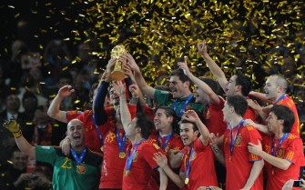Players of Spain celebrate with the FIFA World Cup trophy after defeating The Netherlands 1-0 at Soccer City stadium in Soweto, suburban Johannesburg on July 11, 2010. AFP Players of Spain celebrate with the FIFA World Cup trophy after defeating The Netherlands 1-0 at Soccer City stadium in Soweto, suburban Johannesburg on July 11, 2010. AFP