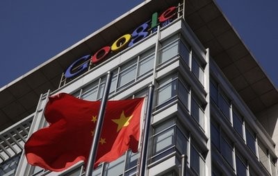In this Jan. 13, 2010 file photo, a Chinese flag flutters outside Google's China headquarters in Beijing. In this Jan. 13, 2010 file photo, a Chinese flag flutters outside Google's China headquarters in Beijing.