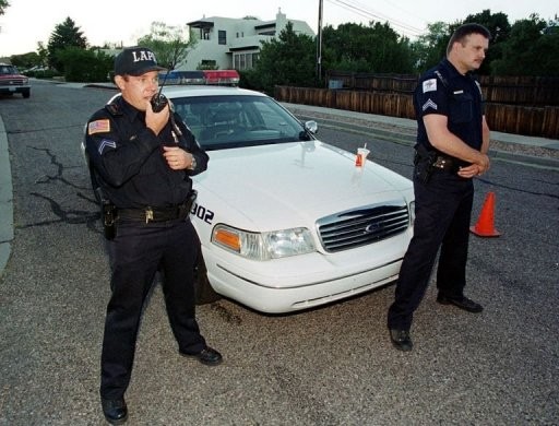 File photo shows police officers manning a road block in New Mexico (AFP) File photo shows police officers manning a road block in New Mexico (AFP)