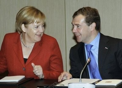 Russian President Dmitry Medvedev (R) speaks with German Chancellor Angela Merkel in Yekaterinburg. Russian President Dmitry Medvedev (R) speaks with German Chancellor Angela Merkel in Yekaterinburg.