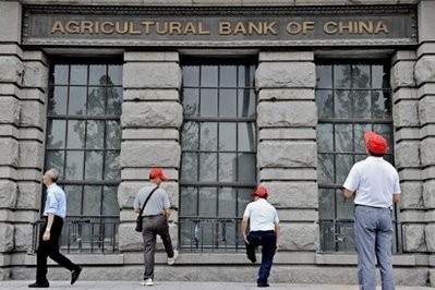 Tourists are seen outside a building housing the key Shanghai branch of the Agricultural Bank of China located on the historic Bund, in the coastal city. Tourists are seen outside a building housing the key Shanghai branch of the Agricultural Bank of China located on the historic Bund, in the coastal city.