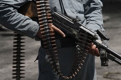 In this June 29, 2010 file photo, an Afghan policeman stands guard at the site of a demonstration in Kabul, Afghanistan In this June 29, 2010 file photo, an Afghan policeman stands guard at the site of a demonstration in Kabul, Afghanistan