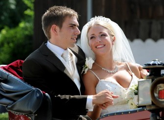 Germany's defender Philipp Lahm and his wife Claudia, former Claudia Schattenberg, drive in a carriage after their marriage in the church of Kleinhelfendorf, southern Germany, July 14, 2010. AFP Germany's defender Philipp Lahm and his wife Claudia, former Claudia Schattenberg, drive in a carriage after their marriage in the church of Kleinhelfendorf, southern Germany, July 14, 2010. AFP