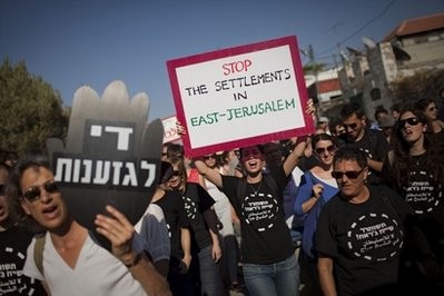 Foreign and Israeli left-wing activists participate in a demonstration in the east Jerusalem neighborhood of Sheikh Jarrah, Friday, July 16, 2010 Foreign and Israeli left-wing activists participate in a demonstration in the east Jerusalem neighborhood of Sheikh Jarrah, Friday, July 16, 2010