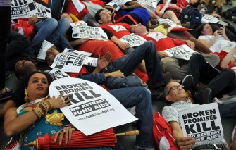 AIDS activists lie on the ground as they hold placards that read "Broken promises kill no retreat fund aids" at the opening of the 18th International AIDS conference on July 18, 2010 in Vienna. AFP AIDS activists lie on the ground as they hold placards that read "Broken promises kill no retreat fund aids" at the opening of the 18th International AIDS conference on July 18, 2010 in Vienna. AFP