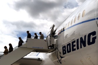 Guests exit a Boeing 787 Dreamliner aircraft at the Farnborough Airshow, Hampshire, on July 18, 2010. AFP Guests exit a Boeing 787 Dreamliner aircraft at the Farnborough Airshow, Hampshire, on July 18, 2010. AFP