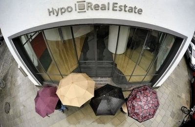 File photo shows people standing outside the headquarters of Hypo Real Estate bank in Munich, Germany. File photo shows people standing outside the headquarters of Hypo Real Estate bank in Munich, Germany.