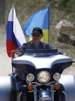 Russia's Prime Minister Vladimir Putin rides Harley Davidson Lehman Trike decorated with Russian and Ukrainian national flags as he arrives for the meeting with motorbikers at their camp near Sevastopol in Ukraine's Crimea on July 24, 2010 Russia's Prime Minister Vladimir Putin rides Harley Davidson Lehman Trike decorated with Russian and Ukrainian national flags as he arrives for the meeting with motorbikers at their camp near Sevastopol in Ukraine's Crimea on July 24, 2010