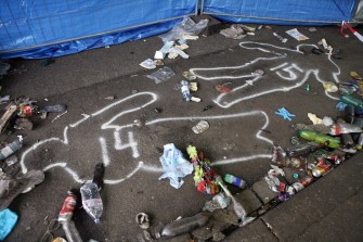Outlines of bodies can be seen at the entrance to the tunnel where panic broke out in a tunnel during the Loveparade in Duisburg. AFP Outlines of bodies can be seen at the entrance to the tunnel where panic broke out in a tunnel during the Loveparade in Duisburg. AFP