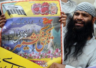 An activist of banned Pakistani organisation Jamaat-ud-Dawa holds a placard during a demonstration in Lahore on July 25, 2010, in a show of solidarity with fellow Muslims in India-administered Kashmir.AFP An activist of banned Pakistani organisation Jamaat-ud-Dawa holds a placard during a demonstration in Lahore on July 25, 2010, in a show of solidarity with fellow Muslims in India-administered Kashmir.AFP