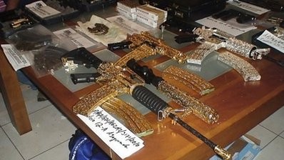 Handout picture released by Mexico's Attorney General Office in May shows gold and silver-plated, diamond-incrusted guns believed to belong to allies of the powerful Sinaloa drug gang, seized by Mexican security forces in Zapopan, Jalisco. Handout picture released by Mexico's Attorney General Office in May shows gold and silver-plated, diamond-incrusted guns believed to belong to allies of the powerful Sinaloa drug gang, seized by Mexican security forces in Zapopan, Jalisco.