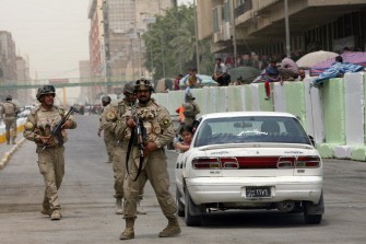 Iraqi soldiers are deployed while reopening al-Jumhuri street by Shorja market in the center of Baghdad on July 31, 2010. AFP PHOTO Iraqi soldiers are deployed while reopening al-Jumhuri street by Shorja market in the center of Baghdad on July 31, 2010. AFP PHOTO