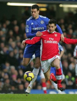 (AFP file) Arsenal midfielder Fabregas vs. Chelsea midfielder Michael Ballack (in red) (AFP file) Arsenal midfielder Fabregas vs. Chelsea midfielder Michael Ballack (in red)