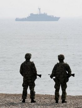 South Korean Marines on patrol on Baengnyeong island near the border with North Korea in March 2010. South Korean Marines on patrol on Baengnyeong island near the border with North Korea in March 2010.