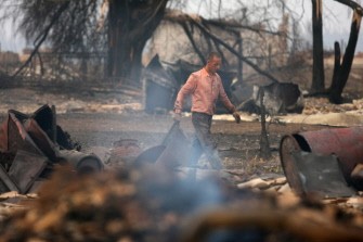 A Russian man walks by his burned out house in the village of Verchnaya Vereya, some 350 kilometres from Moscow, on August 6, 2010. AFP A Russian man walks by his burned out house in the village of Verchnaya Vereya, some 350 kilometres from Moscow, on August 6, 2010. AFP