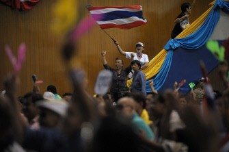 Thai 'Yellow Shirts' wave clappers and national flags during a rally in Bangkok on August 7, 2010. AFP Thai 'Yellow Shirts' wave clappers and national flags during a rally in Bangkok on August 7, 2010. AFP