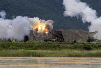 A South Korean Marines K9 Thunder 155mm Self Propelled Howitzer fires during a military exercise in Baengnyeong Island, near the disputed Yellow Sea border between the two Koreas, on August 6, 2010. AFP A South Korean Marines K9 Thunder 155mm Self Propelled Howitzer fires during a military exercise in Baengnyeong Island, near the disputed Yellow Sea border between the two Koreas, on August 6, 2010. AFP