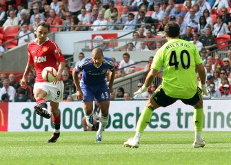 Dimitar Berbatov (L) scores the third goal. AFP Dimitar Berbatov (L) scores the third goal. AFP