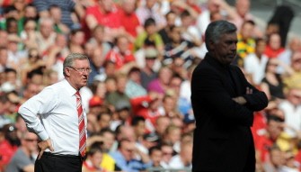 Manchester United's Manager Sir Alex Ferguson (L) looks on from the touchline from behind Chelsea's Manager Carlo Ancelotti (R) during the FA Community Shield football match. AFP Manchester United's Manager Sir Alex Ferguson (L) looks on from the touchline from behind Chelsea's Manager Carlo Ancelotti (R) during the FA Community Shield football match. AFP