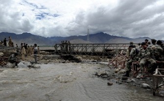 Indian army personnel rest after setting up a temporary bridge at Choglamsar village in Leh on August 8, 2010. AFP Indian army personnel rest after setting up a temporary bridge at Choglamsar village in Leh on August 8, 2010. AFP