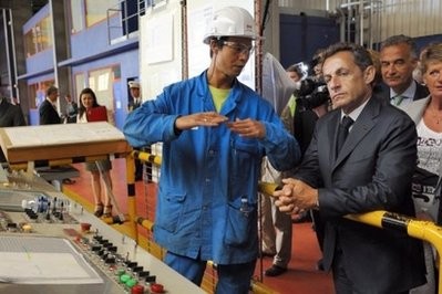 French President Nicolas Sarkozy (R)listens to a worker during a visit to the Saint Nazaire STX shipyard in July. AFP file French President Nicolas Sarkozy (R)listens to a worker during a visit to the Saint Nazaire STX shipyard in July. AFP file