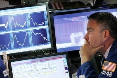 A trader works on the floor of the New York Stock Exchange. A trader works on the floor of the New York Stock Exchange.