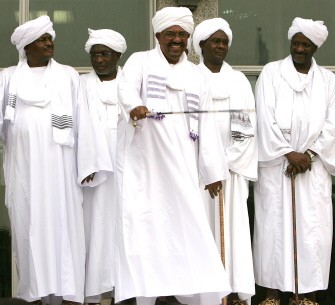 Sudanese President Omar al-Beshir (C) gestures at the crowd during a gathering with supporters from Darfur in the capital Khartoum on August 7, 2010. AFP PHOTO Sudanese President Omar al-Beshir (C) gestures at the crowd during a gathering with supporters from Darfur in the capital Khartoum on August 7, 2010. AFP PHOTO