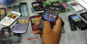 A potential customer checks a Blackberry handset at a shop in New Delhi on August 13, 2010. AFP A potential customer checks a Blackberry handset at a shop in New Delhi on August 13, 2010. AFP