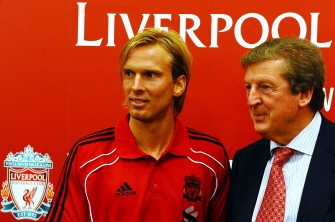 Liverpool Club's manager Roy Hodgson (R), poses for photographers with new signing, Christian Poulsen, following a press conference at their Melwood training ground in Liverpool on August 13, 2010. Liverpool completed the signing of Juventus midfielder Poulsen, paving the way for the possible departure of Argentina captain Javier Mascherano. AFP Liverpool Club's manager Roy Hodgson (R), poses for photographers with new signing, Christian Poulsen, following a press conference at their Melwood training ground in Liverpool on August 13, 2010. Liverpool completed the signing of Juventus midfielder Poulsen, paving the way for the possible departure of Argentina captain Javier Mascherano. AFP