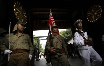 Visitors in Japanese Imperial army and navy uniforms enter Yasukuni Shrine, which honors Japan's war dead, including convicted war criminals, during a ceremony marking the 65th anniversary of the end of World War II, in Tokyo, Sunday, Aug. 15, 2010 Visitors in Japanese Imperial army and navy uniforms enter Yasukuni Shrine, which honors Japan's war dead, including convicted war criminals, during a ceremony marking the 65th anniversary of the end of World War II, in Tokyo, Sunday, Aug. 15, 2010