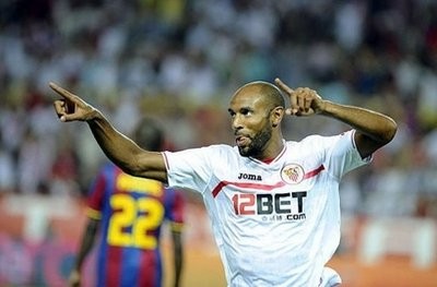 Sevilla's forward Frederic Kanoute celebrates after scoring against Barcelona during a Super Cup football match at Sanchez Pizjuan stadium in Seville Sevilla's forward Frederic Kanoute celebrates after scoring against Barcelona during a Super Cup football match at Sanchez Pizjuan stadium in Seville