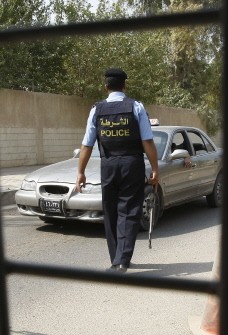 An Iraqi policeman mans a mobile checkpoint where cars are searched in central Baghdad on August 17, 2010, following a suicide bombing at a crowded army recruitment centre in the Iraqi capital early in the morning in which more than 40 people were killed An Iraqi policeman mans a mobile checkpoint where cars are searched in central Baghdad on August 17, 2010, following a suicide bombing at a crowded army recruitment centre in the Iraqi capital early in the morning in which more than 40 people were killed