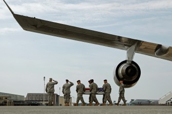 U.S. soldiers carry the flag-draped transfer case containing the remains of Army Specialist Jamal M. Rhett out of a C-17 during a dignified transfer on the tarmac at Dover Air Force Base August 17, 2010 in Dover, Delaware. Assigned to the 1st Battalion, 21st Infantry Regiment, 2nd Brigade Combat Team, 25th Infantry Division, Rhett of Palmyra, New Jersey, died Aug. 15 in Ba Qubah, Iraq. AFP U.S. soldiers carry the flag-draped transfer case containing the remains of Army Specialist Jamal M. Rhett out of a C-17 during a dignified transfer on the tarmac at Dover Air Force Base August 17, 2010 in Dover, Delaware. Assigned to the 1st Battalion, 21st Infantry Regiment, 2nd Brigade Combat Team, 25th Infantry Division, Rhett of Palmyra, New Jersey, died Aug. 15 in Ba Qubah, Iraq. AFP
