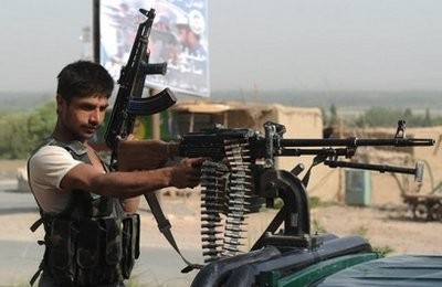 An Afghan policeman patrols in Kandahar province's Arghandab Valley. AFP An Afghan policeman patrols in Kandahar province's Arghandab Valley. AFP
