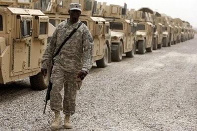 US soldier stands in front of a line of armoured vehicles at Camp Victory, a giant sprawling military base on the edge of Baghdad airport, in June 2010. AFP file US soldier stands in front of a line of armoured vehicles at Camp Victory, a giant sprawling military base on the edge of Baghdad airport, in June 2010. AFP file
