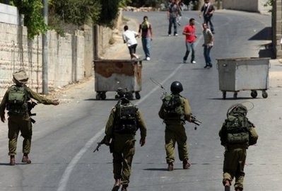 Israeli soldiers and Palestinian demonstrators clash in the occupied West Bank. Israeli soldiers and Palestinian demonstrators clash in the occupied West Bank.