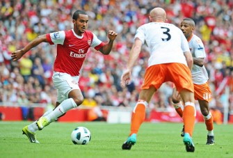 Theo Walcott (L), scorer of three of Arsenal's six goals in action during the English Premier League football match between Arsenal and Blackpool on August 21, 2010. AFP Theo Walcott (L), scorer of three of Arsenal's six goals in action during the English Premier League football match between Arsenal and Blackpool on August 21, 2010. AFP
