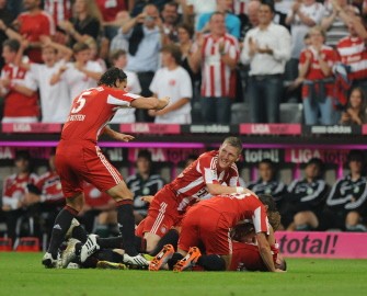 Bayer Munich players celebrate during the German first division Bundesliga football match between FC Bayern Munich and VfL Wolfsburg in the stadium in Munich, southern Germany, August 20, 2010. Bayern Munich won the match 2-1. AFP Bayer Munich players celebrate during the German first division Bundesliga football match between FC Bayern Munich and VfL Wolfsburg in the stadium in Munich, southern Germany, August 20, 2010. Bayern Munich won the match 2-1. AFP