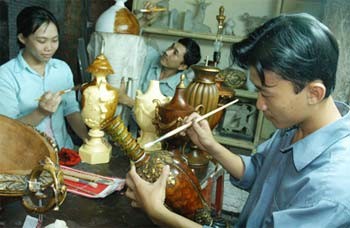 Artisans make art handicraft products for export at Quan Quan Co. Artisans make art handicraft products for export at Quan Quan Co.