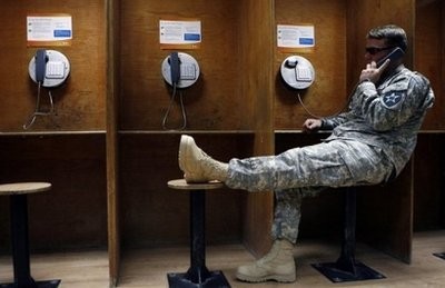 A US soldier speaks to his family from Kuwait after his unit withdrew from Iraq. AFP file A US soldier speaks to his family from Kuwait after his unit withdrew from Iraq. AFP file