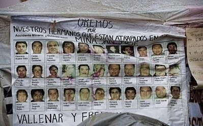 Picture of a banner with the pictures of the 33 miners trapped in the San Esteban gold and copper mine in Copiapo, 800 km north of Santiago. AFP Picture of a banner with the pictures of the 33 miners trapped in the San Esteban gold and copper mine in Copiapo, 800 km north of Santiago. AFP