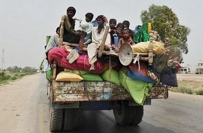 Pakistani flood-affected villagers travel with their belongings as they evacuate Matyari, about 35 kilometers from Hyderabad. Pakistani flood-affected villagers travel with their belongings as they evacuate Matyari, about 35 kilometers from Hyderabad.