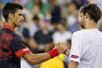 Novak Djokovic (L) shakes hands with Philipp Petzschner after defeating him during day four of the 2010 U.S. Open. AFP Novak Djokovic (L) shakes hands with Philipp Petzschner after defeating him during day four of the 2010 U.S. Open. AFP