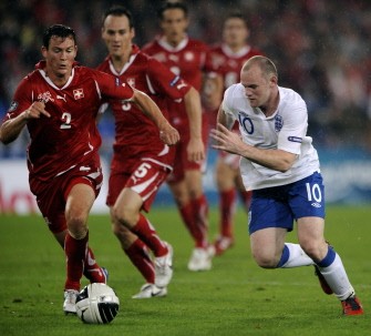 Wayne Rooney (R) vies for the ball with Switzerland's defender Lichtsteiner Stephan (Far L) and teammate defender Steve Von Bergen during their match Switzerland against England on September 7, 2010 in Basel. AFP Wayne Rooney (R) vies for the ball with Switzerland's defender Lichtsteiner Stephan (Far L) and teammate defender Steve Von Bergen during their match Switzerland against England on September 7, 2010 in Basel. AFP