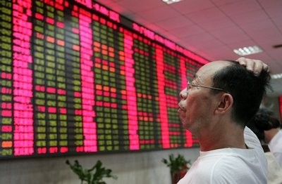 An investor looks at the stock price monitor at a private securities company Thursday, Sept. 9, 2010 in Shanghai, China. An investor looks at the stock price monitor at a private securities company Thursday, Sept. 9, 2010 in Shanghai, China.