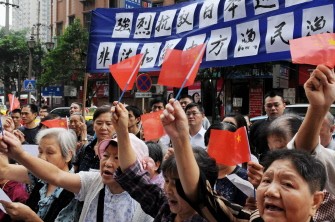 A group of elderly Chinese people, portraying themselves as WWII survivors who witnessed the astrocities committed by Japanese soldiers, hold placard saying "Strongly protest against the illegally seizure of a Chinese trawler by Japanese vessels", in southwest China's Chongqing municipality on September 10, 2010. AFP A group of elderly Chinese people, portraying themselves as WWII survivors who witnessed the astrocities committed by Japanese soldiers, hold placard saying "Strongly protest against the illegally seizure of a Chinese trawler by Japanese vessels", in southwest China's Chongqing municipality on September 10, 2010. AFP