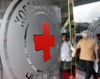 A South Korean man, right, is guided by a volunteer to fill out an application form to reunite with his family members who are living in North Korea, at the headquarters of the Korean Red Cross in Seoul, South Korea, Monday, Sept. 13, 2010 A South Korean man, right, is guided by a volunteer to fill out an application form to reunite with his family members who are living in North Korea, at the headquarters of the Korean Red Cross in Seoul, South Korea, Monday, Sept. 13, 2010
