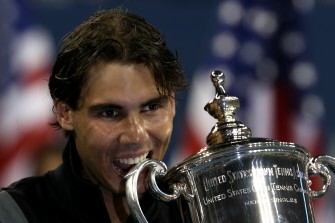 Nadal bites his championship trophy on September 13, 2010. AFP Nadal bites his championship trophy on September 13, 2010. AFP