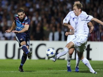 Lyon's Argentinian forward Lisandro Lopez (L) kicks the ball in front of Schalke's Croatian midfielder Ivan Rakitic (R) during the game. AFP Lyon's Argentinian forward Lisandro Lopez (L) kicks the ball in front of Schalke's Croatian midfielder Ivan Rakitic (R) during the game. AFP