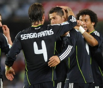 Real Madrid's players congratulate Cristiano Ronaldo (C) after Real Madrid's defender Pepe scored thanks to a kick from Ronaldo during the match against Real Sociedad on September 18, 2010. AFP Real Madrid's players congratulate Cristiano Ronaldo (C) after Real Madrid's defender Pepe scored thanks to a kick from Ronaldo during the match against Real Sociedad on September 18, 2010. AFP